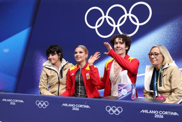 (260212) -- MILAN, Feb. 12, 2026 (Xinhua) -- Sofia Val and Asaf Kazimov of Spain react as they wait for the scores during the free dance competition of figure skating ice dance at the Milan-Cortina 2026 Olympic Winter Games in Milan, Italy, Feb. 11, 2026. (Xinhua/Chen Yichen)