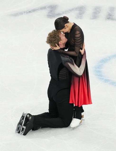 (260212) -- MILAN, Feb. 12, 2026 (Xinhua) -- Madison Chock and Evan Bates of the United States react after performing during the free dance competition of figure skating ice dance at the Milan-Cortina 2026 Olympic Winter Games in Milan, Italy, Feb. 11, 2026. (Xinhua/Xue Yuge)