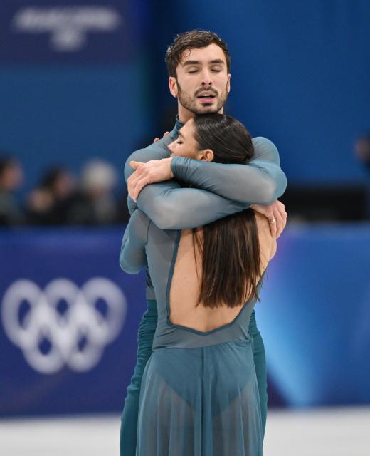 (260212) -- MILAN, Feb. 12, 2026 (Xinhua) -- Laurence Fournier Beaudry and Guillaume Cizeron of France react after performing during the free dance competition of figure skating ice dance at the Milan-Cortina 2026 Olympic Winter Games in Milan, Italy, Feb. 11, 2026. (Xinhua/Cheng Min)