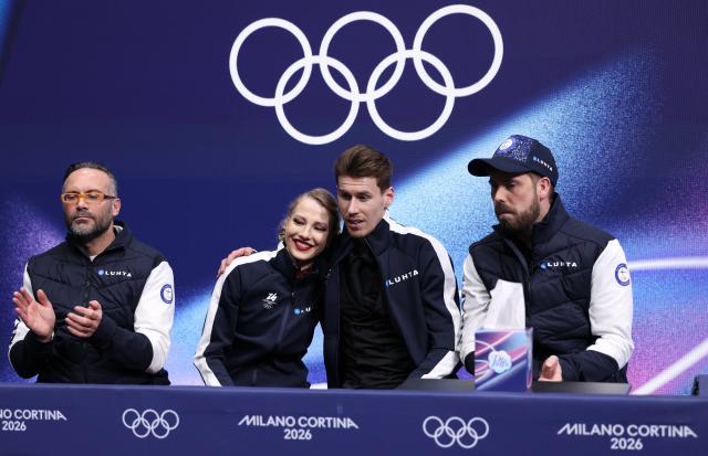 (260212) -- MILAN, Feb. 12, 2026 (Xinhua) -- Juulia Turkkila and Matthias Versluis of Finland react as they wait for the scores during the free dance competition of figure skating ice dance at the Milan-Cortina 2026 Olympic Winter Games in Milan, Italy, Feb. 11, 2026. (Xinhua/Chen Yichen)