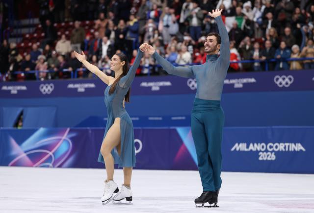 (260212) -- MILAN, Feb. 12, 2026 (Xinhua) -- Gold medalists Laurence Fournier Beaudry and Guillaume Cizeron of France react after performing during the free dance competition of figure skating ice dance at the Milan-Cortina 2026 Olympic Winter Games in Milan, Italy, Feb. 11, 2026. (Xinhua/Chen Yichen)