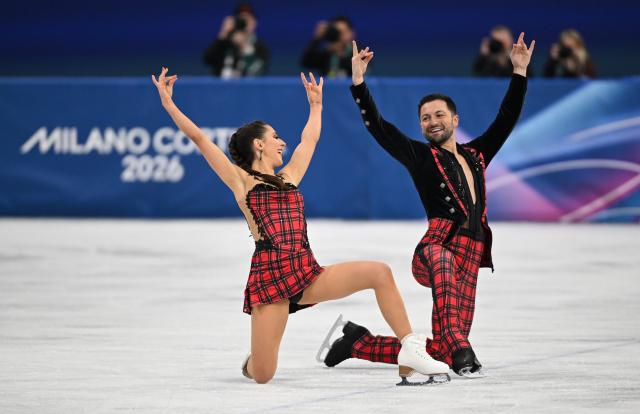(260212) -- MILAN, Feb. 12, 2026 (Xinhua) -- Lilah Fear and Lewis Gibson of Britain perform during the free dance competition of figure skating ice dance at the Milan-Cortina 2026 Olympic Winter Games in Milan, Italy, Feb. 11, 2026. (Xinhua/Cheng Min)