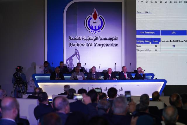 (260212) -- TRIPOLI, Feb. 12, 2026 (Xinhua) -- This photo shows the announcement of the results of the Libya bid round held in Tripoli, Libya, Feb. 11, 2026.
  Libya's National Oil Corporation (NOC) said Wednesday that several international companies have secured oil and gas exploration rights.
  Five companies from Spain, Hungary, Nigeria, and Italy were awarded exploration blocks in the onshore Sirte and Murzuq basins and the offshore Sirte basin in the Mediterranean, the NOC said. (Photo by Hazem Turkia/Xinhua)
