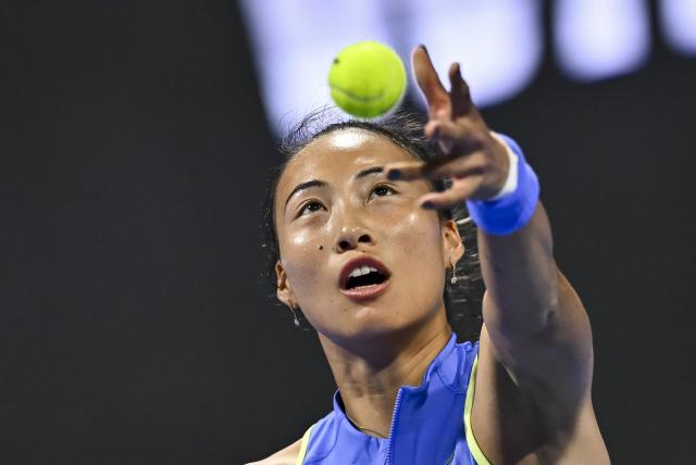 (260212) -- DOHA, Feb. 12, 2026 (Xinhua) -- Zheng Qinwen of China serves during the women's singles round of 16 match between Zheng Qinwen of China and Elena Rybakina of Kazakhstan at the WTA Qatar Open 2026 tennis tournament in Doha, Qatar, Feb. 11, 2026. (Photo by Nikku/Xinhua)