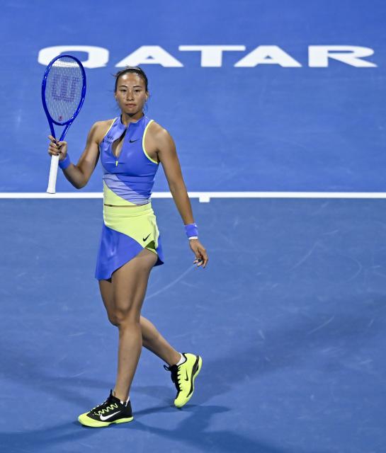 (260212) -- DOHA, Feb. 12, 2026 (Xinhua) -- Zheng Qinwen of China reacts during the women's singles round of 16 match between Zheng Qinwen of China and Elena Rybakina of Kazakhstan at the WTA Qatar Open 2026 tennis tournament in Doha, Qatar, Feb. 11, 2026. (Photo by Nikku/Xinhua)