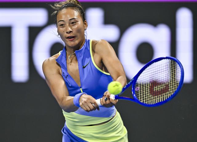 (260212) -- DOHA, Feb. 12, 2026 (Xinhua) -- Zheng Qinwen of China hits a return during the women's singles round of 16 match between Zheng Qinwen of China and Elena Rybakina of Kazakhstan at the WTA Qatar Open 2026 tennis tournament in Doha, Qatar, Feb. 11, 2026. (Photo by Nikku/Xinhua)