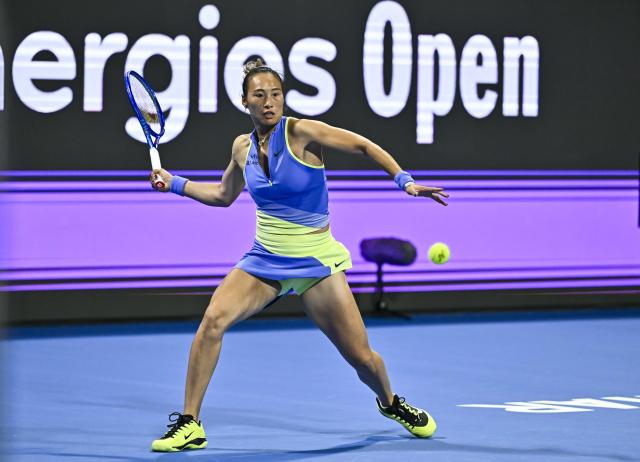 (260212) -- DOHA, Feb. 12, 2026 (Xinhua) -- Zheng Qinwen of China hits a return during the women's singles round of 16 match between Zheng Qinwen of China and Elena Rybakina of Kazakhstan at the WTA Qatar Open 2026 tennis tournament in Doha, Qatar, Feb. 11, 2026. (Photo by Nikku/Xinhua)