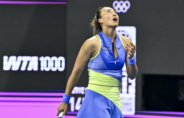 (260212) -- DOHA, Feb. 12, 2026 (Xinhua) -- Zheng Qinwen of China reacts during the women's singles round of 16 match between Zheng Qinwen of China and Elena Rybakina of Kazakhstan at the WTA Qatar Open 2026 tennis tournament in Doha, Qatar, Feb. 11, 2026. (Photo by Nikku/Xinhua)