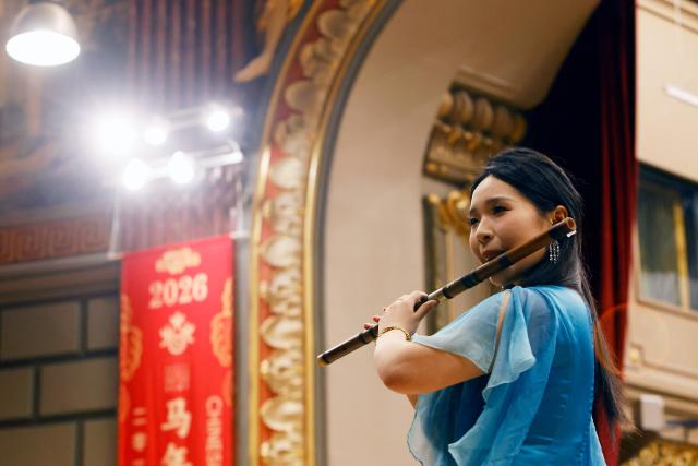 (260212) -- BUCHAREST, Feb. 12, 2026 (Xinhua) -- A member of the Wuxi Chinese Orchestra performs during the "Happy Chinese New Year" concert in Bucharest, Romania, Feb. 10, 2026.
  TO GO WITH "Chinese, Romanian musicians share stage to welcome Year of the Horse" (Photo by Cristian Cristel/Xinhua)