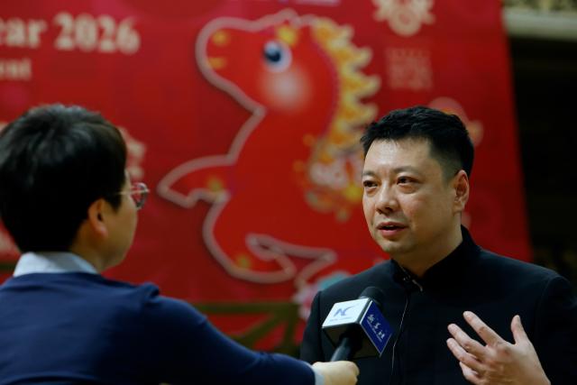 (260212) -- BUCHAREST, Feb. 12, 2026 (Xinhua) -- Sun Peng, music director and principal conductor of the Wuxi Chinese Orchestra, speaks during an interview with Xinhua after the "Happy Chinese New Year" concert in Bucharest, Romania, Feb. 10, 2026.
  TO GO WITH "Chinese, Romanian musicians share stage to welcome Year of the Horse" (Photo by Cristian Cristel/Xinhua)