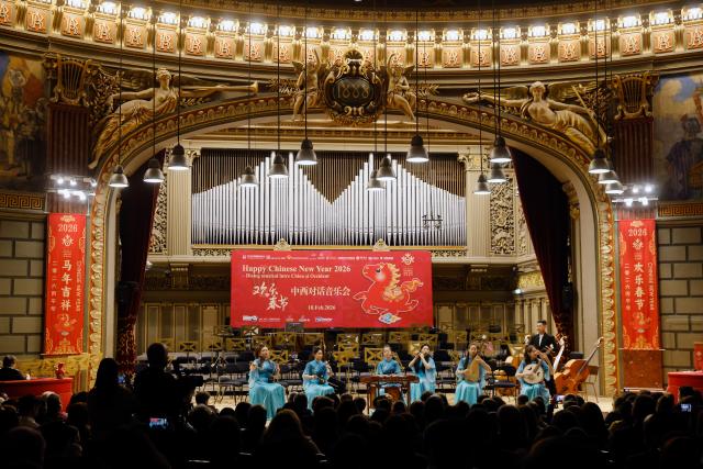 (260212) -- BUCHAREST, Feb. 12, 2026 (Xinhua) -- Members of the Wuxi Chinese Orchestra and the Symphony Orchestra of Dinu Lipatti National College of Arts perform during the "Happy Chinese New Year" concert in Bucharest, Romania, Feb. 10, 2026.
  TO GO WITH "Chinese, Romanian musicians share stage to welcome Year of the Horse" (Photo by Cristian Cristel/Xinhua)