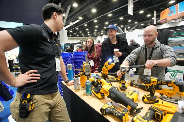 (260212) -- VANCOUVER, Feb. 12, 2026 (Xinhua) -- People check out power tools at the BUILDEX 2026 trade show at the Vancouver Convention Center in Vancouver, British Columbia, Canada, on Feb. 11, 2026.
  The BUILDEX 2026 kicked off here on Wednesday. (Photo by Liang Sen/Xinhua)