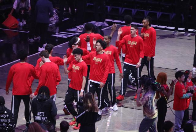 (260212) -- NEW YORK, Feb. 12, 2026 (Xinhua) -- Nets' players wear custom Chinese New Year shooting shirts during warmups at Barclays Center in New York, the United States, Feb. 11, 2026. (Xinhua/Zhang Fengguo)