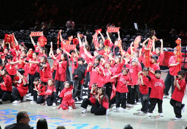 (260212) -- NEW YORK, Feb. 12, 2026 (Xinhua) -- Children extend a greeting of happy Chinese New Year during a performance at Barclays Center in New York, the United States, Feb. 11, 2026. (Xinhua/Zhang Fengguo)
