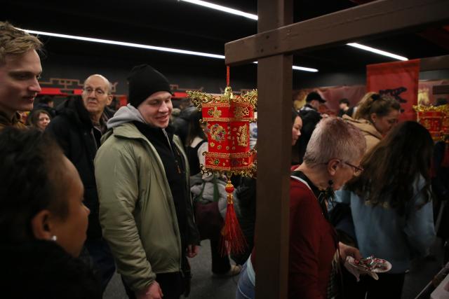 (260212) -- NEW YORK, Feb. 12, 2026 (Xinhua) -- People attend a cultural experience inspired by the ancient Chinese "Yi Zhan" at Barclays Center in New York, the United States, Feb. 11, 2026. (Xinhua/Zhang Fengguo)
