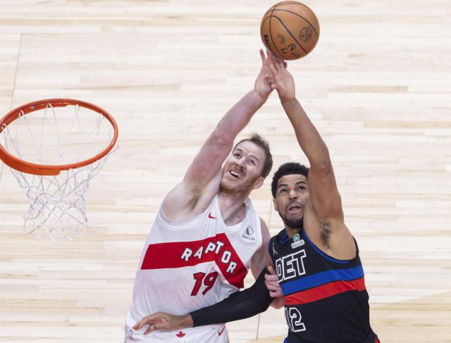 (260212) -- TORONTO, Feb. 12, 2026 (Xinhua) -- Jakob Poeltl (L) of Toronto Raptors fights for a rebound with Tobias Harris of Detroit Pistons during the 2025-2026 NBA regular season game between Toronto Raptors and Detroit Pistons in Toronto, Canada, Feb. 11, 2026. (Photo by Zou Zheng/Xinhua)