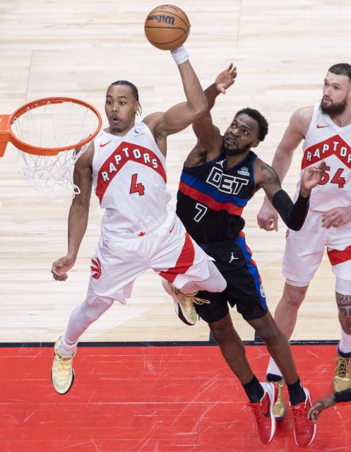 (260212) -- TORONTO, Feb. 12, 2026 (Xinhua) -- Scottie Barnes (L) of Toronto Raptors dunks during the 2025-2026 NBA regular season game between Toronto Raptors and Detroit Pistons in Toronto, Canada, Feb. 11, 2026. (Photo by Zou Zheng/Xinhua)