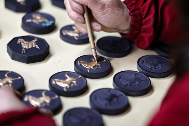 (260212) -- HUANGSHAN, Feb. 12, 2026 (Xinhua) -- A crafter paints Hui ink sticks inspired by the Chinese zodiac Year of the Horse at an ink workshop in Shexian County, east China's Anhui Province, Feb. 11, 2026.
  Delicate Hui ink sticks inspired by the Chinese zodiac Year of the Horse delight the eyes, making the millennium-old ink-making craftsmanship shine again.
  Hui ink sticks are mainly crafted in east China's Anhui Province, hence earning the moniker "Hui" ink, as the region was originally under the jurisdiction of Huizhou in ancient China. (Photo by Shi Yalei/Xinhua)