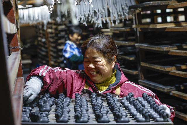 (260212) -- HUANGSHAN, Feb. 12, 2026 (Xinhua) -- A craftswoman airs Hui ink sticks inspired by the Chinese zodiac Year of the Horse at an ink workshop in Shexian County, east China's Anhui Province, Jan. 5, 2026.
  Delicate Hui ink sticks inspired by the Chinese zodiac Year of the Horse delight the eyes, making the millennium-old ink-making craftsmanship shine again.
  Hui ink sticks are mainly crafted in east China's Anhui Province, hence earning the moniker "Hui" ink, as the region was originally under the jurisdiction of Huizhou in ancient China. (Xinhua/Zhou Mu)