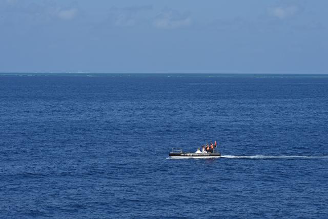 (260212) -- SOUTH CHINA SEA, Feb. 12, 2026 (Xinhua) -- A small boat released by the China Coast Guard (CCG) vessel Wanshan conducts a law enforcement drill in the territorial waters of China's Huangyan Dao, Feb. 4, 2026. (Photo by Zhai Yifan/Xinhua)