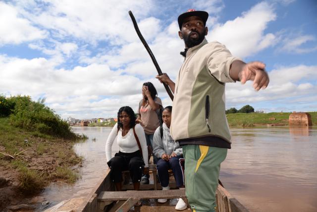 (260212) -- ANTANANARIVO, Feb. 12, 2026 (Xinhua) -- A boatman delivers passengers after Cyclone Gezani hit Antananarivo, capital of Madagascar, on Feb. 12, 2026. The Malagasy government declared a "state of national disaster" on Wednesday in response to the widespread devastation caused by Cyclone Gezani. 
   The storm brought extensive damage to infrastructure, homes and livelihoods, along with severe flooding and significant economic losses. (Photo by Sitraka Rajaonarison/Xinhua)