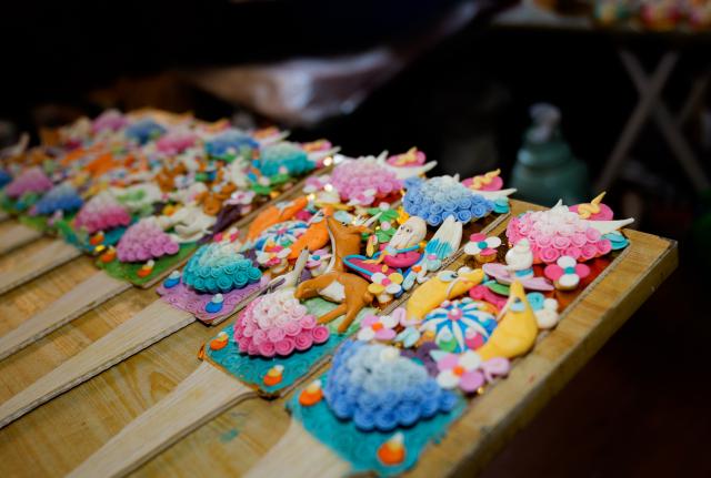 (260212) -- LHASA, Feb. 12, 2026 (Xinhua) -- This photo shows butter sculptures at a workshop in Lhasa, southwest China's Xizang Autonomous Region, Feb. 12, 2026. Butter sculptures in vivid shapes of trees, flowers, birds, stars, etc., are gradually gaining popularity in the markets across the city ahead of the Tibetan New Year.
   These sculptures, made skillfully with colored butter, convey people's good wishes for the New Year. (Xinhua/Tenzin Nyida)