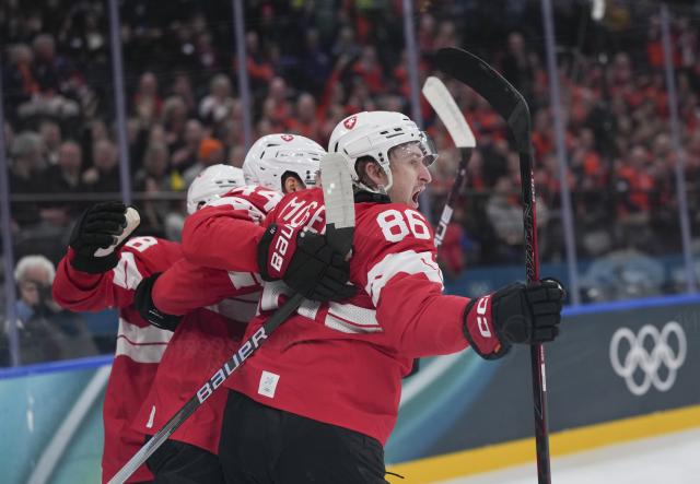 (260212) -- MILAN, Feb. 12, 2026 (Xinhua) -- Players of Switzerland celebrate during the ice hockey men's preliminary round group A match between Switzerland and France at the Milan-Cortina 2026 Olympic Winter Games in Milan, Italy, Feb. 12, 2026. (Xinhua/Tao Xiyi)