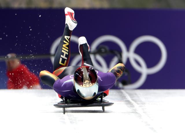 (260212) -- CORTINA D'AMPEZZO, Feb. 12, 2026 (Xinhua) -- Chen Wenhao of China competes during the skeleton men heat at the 2026 Milan-Cortina Winter Olympics in Cortina D'Ampezzo, Italy, Feb. 12, 2026. (Xinhua/Ding Xu)