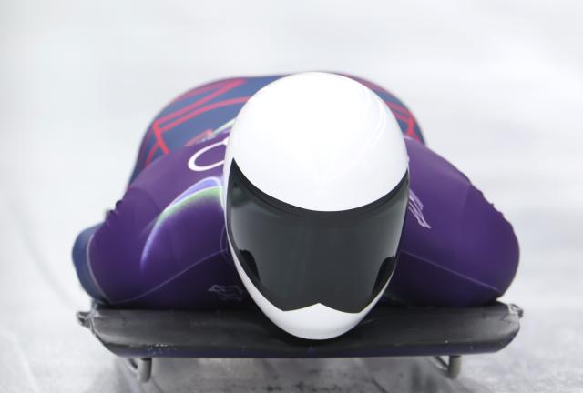 (260212) -- CORTINA D'AMPEZZO, Feb. 12, 2026 (Xinhua) -- Matt Weston of Britain competes during the skeleton men heat at the 2026 Milan-Cortina Winter Olympics in Cortina D'Ampezzo, Italy, Feb. 12, 2026. (Xinhua/Ding Xu)