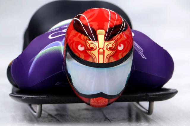 (260212) -- CORTINA D'AMPEZZO, Feb. 12, 2026 (Xinhua) -- Yin Zheng of China competes during the skeleton men heat at the 2026 Milan-Cortina Winter Olympics in Cortina D'Ampezzo, Italy, Feb. 12, 2026. (Xinhua/Ding Xu)