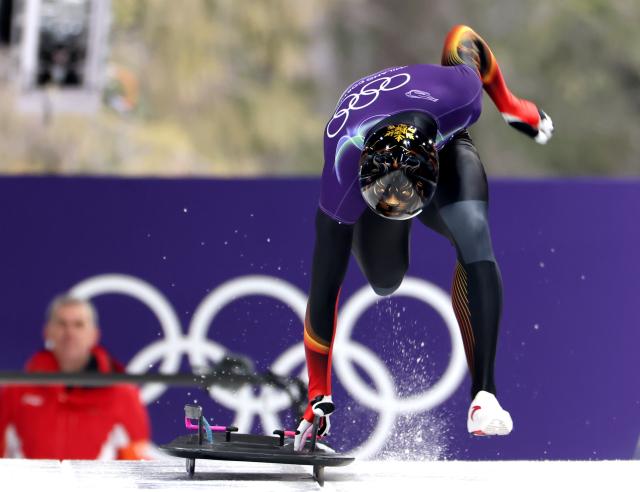 (260212) -- CORTINA D'AMPEZZO, Feb. 12, 2026 (Xinhua) -- Lin Qinwen of China competes during the skeleton men heat at the 2026 Milan-Cortina Winter Olympics in Cortina D'Ampezzo, Italy, Feb. 12, 2026. (Xinhua/Ding Xu)