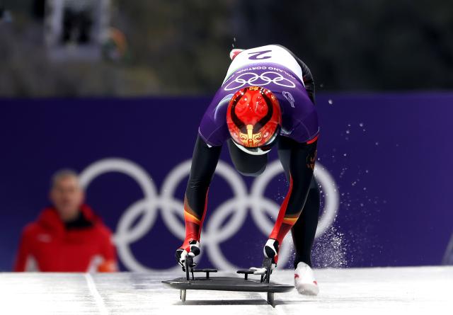 (260212) -- CORTINA D'AMPEZZO, Feb. 12, 2026 (Xinhua) -- Yin Zheng of China competes during the skeleton men heat at the 2026 Milan-Cortina Winter Olympics in Cortina D'Ampezzo, Italy, Feb. 12, 2026. (Xinhua/Ding Xu)