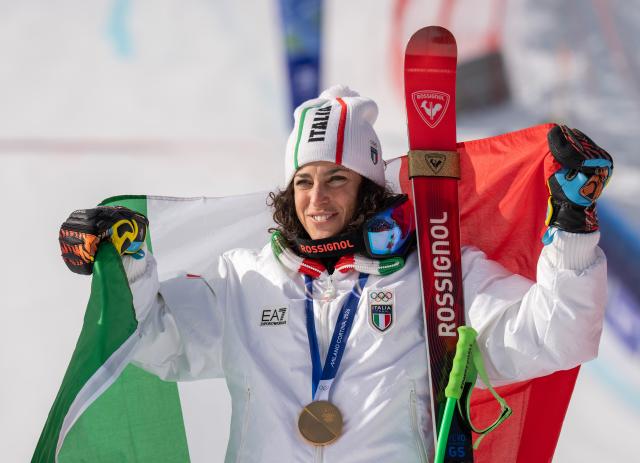 (260212) -- CORTINA D'AMPEZZO, Feb. 12, 2026 (Xinhua) -- Gold medalist Federica Brignone of Italy reacts during the awarding ceremony for the alpine skiing women's Super-G at the 2026 Milan-Cortina Winter Olympics in Cortina D'Ampezzo, Italy, Feb. 12, 2026. (Xinhua/Fei Maohua)