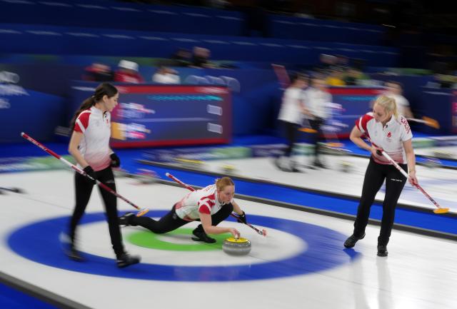 (260212) -- CORTINA D'AMPEZZO, Feb. 12, 2026 (Xinhua) -- Mathilde Halse (C) of Denmark competes during the curling women round robin session 1 match between Canada and Denmark at the 2026 Milan-Cortina Winter Olympics in Cortina D'Ampezzo, Italy, Feb. 12, 2026. (Xinhua/Li Gang)