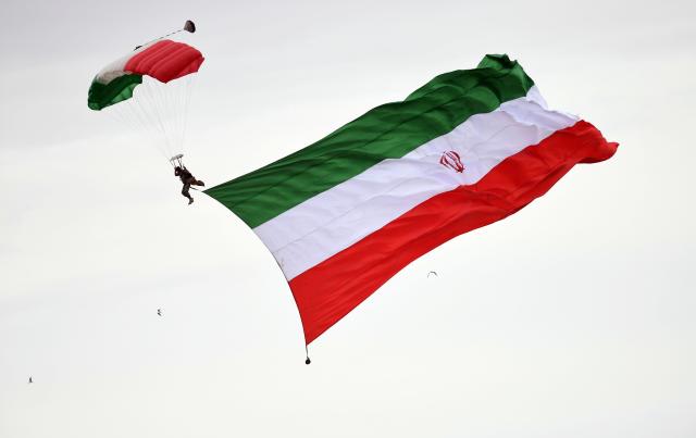 (260212) -- TEHRAN, Feb. 12, 2026 (Xinhua) -- A parachuter performs during the celebrations for the 47th anniversary of the 1979 Islamic Revolution in Tehran, Iran, Feb. 11, 2026. (Xinhua/Shadati)