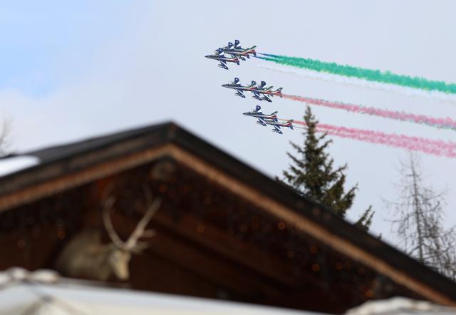 (260212) -- CORTINA D'AMPEZZO, Feb. 12, 2026 (Xinhua) -- The Italian Air Force's Frecce Tricolori aerobatic squad flies above after the alpine skiing women's Super-G at the 2026 Milan-Cortina Winter Olympics in Cortina D'Ampezzo, Italy, Feb. 12, 2026. (Xinhua/Zhang Chenlin)
