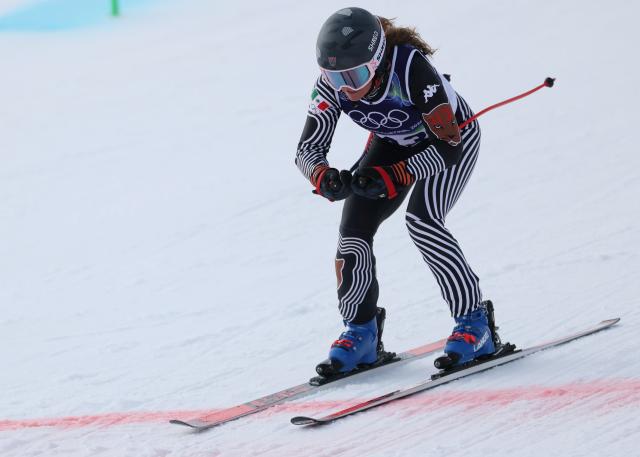 (260212) -- CORTINA D'AMPEZZO, Feb. 12, 2026 (Xinhua) -- Sarah Schleper of Mexico crosses the finish line during the alpine skiing women's Super-G at the 2026 Milan-Cortina Winter Olympics in Cortina D'Ampezzo, Italy, Feb. 12, 2026. (Xinhua/Zhang Chenlin)