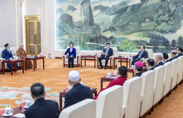(260212) -- BEIJING, Feb. 12, 2026 (Xinhua) -- Wang Huning, chairman of the National Committee of the Chinese People's Political Consultative Conference, also a member of the Standing Committee of the Political Bureau of the Communist Party of China (CPC) Central Committee, meets with leaders of national religious groups ahead of the Chinese New Year, on Feb. 12, 2026. Wang on Thursday extended Spring Festival greetings to religious leaders and believers across China. (Xinhua/Li Tao)