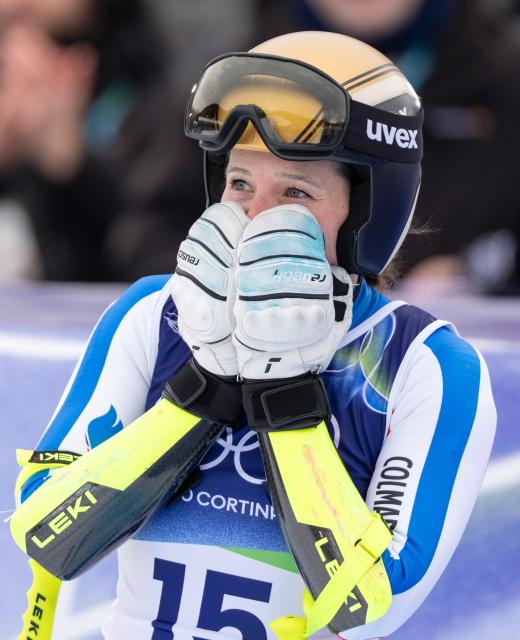 (260212) -- CORTINA D'AMPEZZO, Feb. 12, 2026 (Xinhua) -- Romane Miradoli of France reacts after the alpine skiing women's Super-G at the 2026 Milan-Cortina Winter Olympics in Cortina, Italy, Feb. 12, 2026. (Xinhua/Fei Maohua)