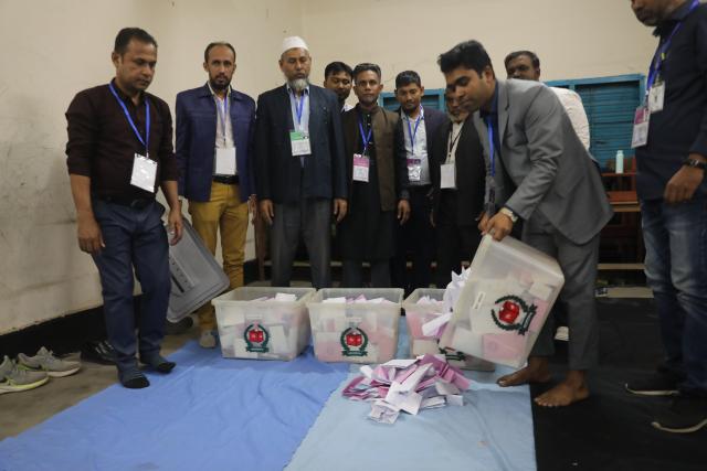 (260212) -- DHAKA, Feb. 12, 2026 (Xinhua) -- Electoral officials sort ballot papers as counting begins at a polling station in Dhaka, Bangladesh, Feb. 12, 2026. The Bangladesh Nationalist Party (BNP), led by Tarique Rahman, has emerged as the early front-runner in Thursday's general election in Bangladesh, according to primary results. (Photo by Habibur Rahman/Xinhua)