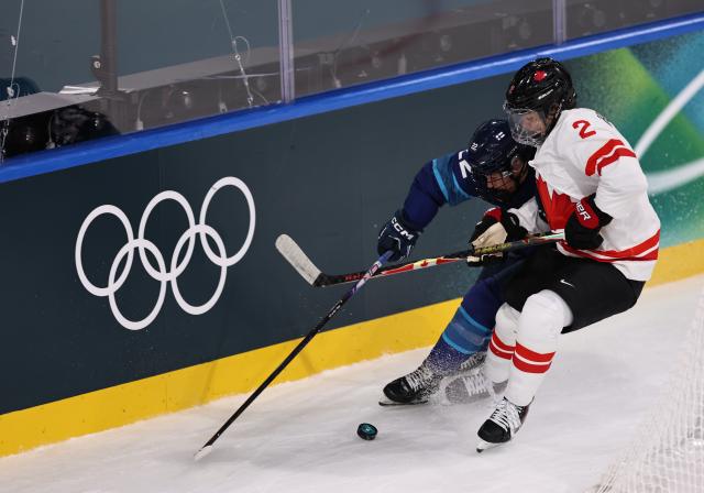 (260212) -- MILAN, Feb. 12, 2026 (Xinhua) -- Sophie Jaques (R) of Canada vies with Julia Schalin of Finland during the ice hockey women's preliminary round group A match between Finland and Canada at the Milan-Cortina 2026 Olympic Winter Games in Milan, Italy, Feb. 12, 2026. (Xinhua/Wang Kaiyan)