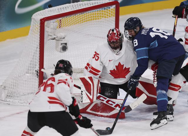 (260212) -- MILAN, Feb. 12, 2026 (Xinhua) -- Goalkeeper Ann-Renee Desbiens (C) of Canada saves the puck during the ice hockey women's preliminary round group A match between Finland and Canada at the Milan-Cortina 2026 Olympic Winter Games in Milan, Italy, Feb. 12, 2026. (Xinhua/Wang Kaiyan)