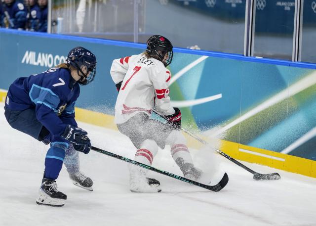(260212) -- MILAN, Feb. 12, 2026 (Xinhua) -- Laura Stacey (R) of Canada competes during the ice hockey women's preliminary round group A match between Finland and Canada at the Milan-Cortina 2026 Olympic Winter Games in Milan, Italy, Feb. 12, 2026. (Xinhua/Sun Fei)