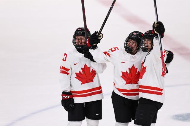 (260212) -- MILAN, Feb. 12, 2026 (Xinhua) -- Players of Canada celebrate scoring during the ice hockey women's preliminary round group A match between Finland and Canada at the Milan-Cortina 2026 Olympic Winter Games in Milan, Italy, Feb. 12, 2026. (Xinhua/Wang Kaiyan)