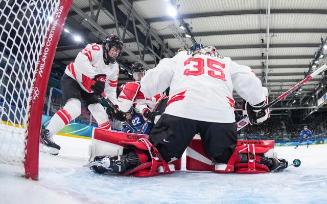 (260212) -- MILAN, Feb. 12, 2026 (Xinhua) -- Goalkeeper Ann-Renee Desbiens (C) of Canada saves the puck during the ice hockey women's preliminary round group A match between Finland and Canada at the Milan-Cortina 2026 Olympic Winter Games in Milan, Italy, Feb. 12, 2026. (Sun Fei/Pool via Xinhua)