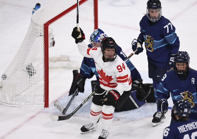 (260212) -- MILAN, Feb. 12, 2026 (Xinhua) -- Jennifer Gardiner (L, front) of Canada celebrates a goal during the ice hockey women's preliminary round group A match between Finland and Canada at the Milan-Cortina 2026 Olympic Winter Games in Milan, Italy, Feb. 12, 2026. (Xinhua/Wang Kaiyan)