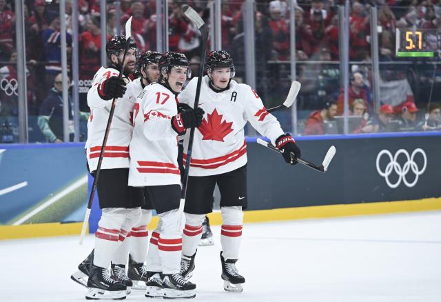 (260212) -- MILAN, Feb. 12, 2026 (Xinhua) -- Players of Canada celebrate scoring during the ice hockey men's preliminary round group A match between Canada and the Czech Republic at the Milan-Cortina 2026 Olympic Winter Games in Milan, Italy, Feb. 12, 2026. (Xinhua/Zhang Haofu)