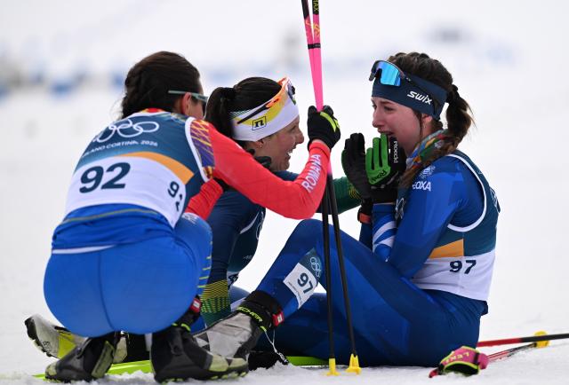 (260212) -- TESERO, Feb. 12, 2026 (Xinhua) -- Nefeli Tita (R) of Germany reacts after the cross-country skiing women's 10km interval start free match at the Milan-Cortina 2026 Olympic Winter Games in Tesero, Italy, Feb. 12, 2026. (Xinhua/He Canling)