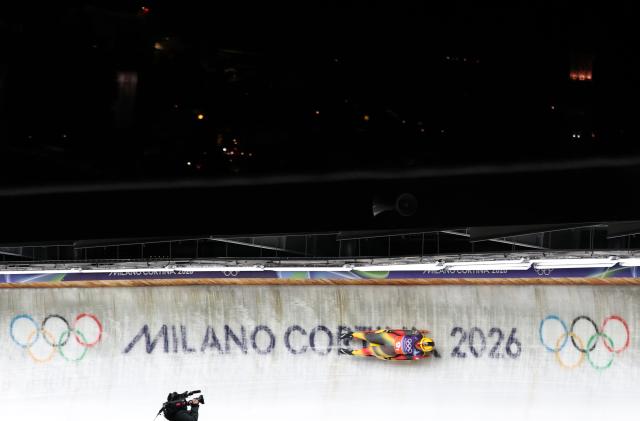 (260212) -- CORTINA D'AMPEZZO, Feb. 12, 2026 (Xinhua) -- Julia Taubitz of Germany competes during the luge team relay match at the Milan-Cortina 2026 Olympic Winter Games in Cortina, Italy, Feb. 12, 2026. (Xinhua/Ding Xu)
