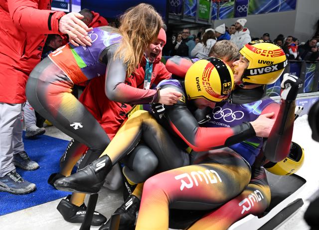 (260212) -- CORTINA D'AMPEZZO, Feb. 12, 2026 (Xinhua) -- Athletes of Germany celebrate after the luge team relay match at the Milan-Cortina 2026 Olympic Winter Games in Cortina, Italy, Feb. 12, 2026. (Xinhua/Lian Yi)